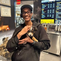 Picture of Jason holding a dog